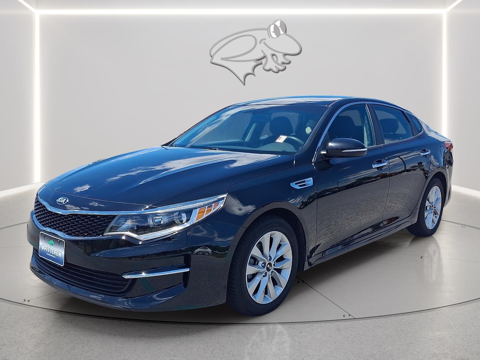 2018 Kia Optima LX in Ebony Black — front three-quarter view